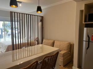a living room with a table and a couch at Relax Guemes in Mar del Plata