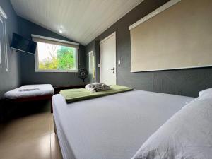 Espaço Verano - Suítes客房内的一张或多张床位