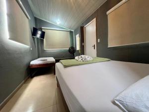 Espaço Verano - Suítes客房内的一张或多张床位