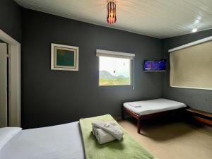 Espaço Verano - Suítes客房内的一张或多张床位