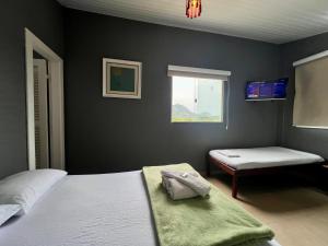 Espaço Verano - Suítes客房内的一张或多张床位