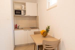 Kuchyňa alebo kuchynka v ubytovaní Apartments Gianni