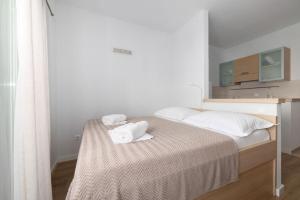 Posteľ alebo postele v izbe v ubytovaní Apartments Gianni