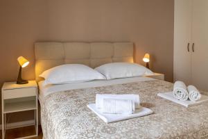 Posteľ alebo postele v izbe v ubytovaní Apartments Gianni