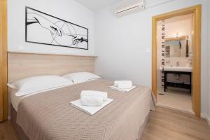 Posteľ alebo postele v izbe v ubytovaní Apartments Gianni