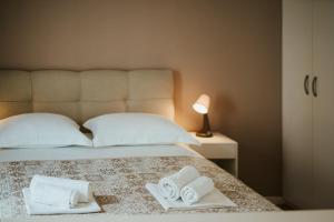 Posteľ alebo postele v izbe v ubytovaní Apartments Gianni