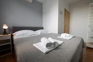 Posteľ alebo postele v izbe v ubytovaní Apartments Gianni