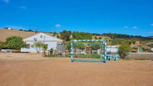 a playground with a goal in a dirt field at Luxurious Villa in Prado del Rey with Pool in Prado del Rey