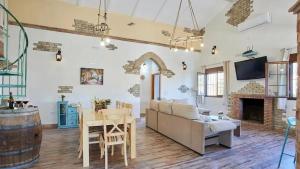 a living room with a couch and a table at Luxurious Villa in Prado del Rey with Pool in Prado del Rey