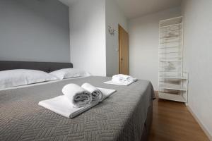Posteľ alebo postele v izbe v ubytovaní Apartments Gianni