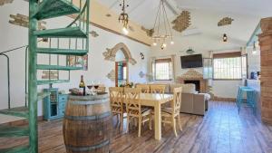 a dining room and living room with a table and chairs at Luxurious Villa in Prado del Rey with Pool in Prado del Rey +23 photos