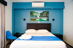 Postel nebo postele na pokoji v ubytování Hotel Luckys