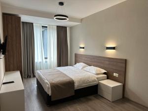 Voodi või voodid majutusasutuse Kristal bakuriani Resort C block 202 toas