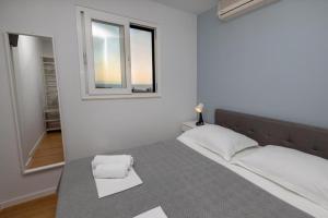 Posteľ alebo postele v izbe v ubytovaní Apartments Gianni