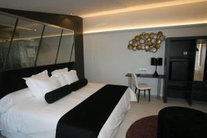 Posteľ alebo postele v izbe v ubytovaní Hotel Cardenal