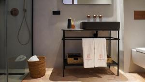 Koupelna v ubytování Tradere Hotel Boutique + 27 fotografií