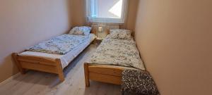 Postel nebo postele na pokoji v ubytování Kecelhegyi Vendégház