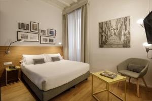Postel nebo postele na pokoji v ubytování Coronari Palace