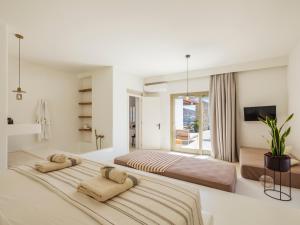 Ένα ή περισσότερα κρεβάτια σε δωμάτιο στο SELINOE The Ultimate Experience