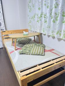 Postel nebo postele na pokoji v ubytování 天六inn