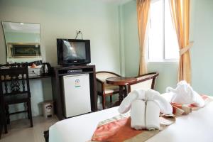 Postel nebo postele na pokoji v ubytování Fahsai Bay Villa