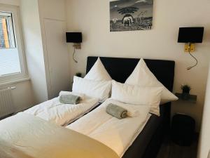 a bed with two pillows on it in a room at Ferienwohnung Stern in Goslar