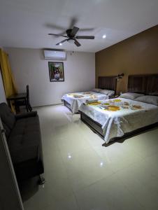 Postel nebo postele na pokoji v ubytování Hotel D’Cural