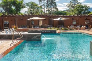a pool with a water slide in the middle at Inn & Spa at Loretto in Santa Fe