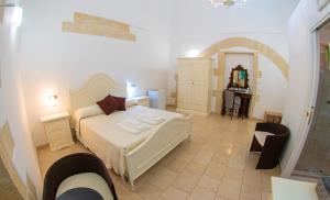 Postel nebo postele na pokoji v ubytování Palazzo Vilei