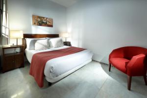 Säng eller sängar i ett rum på Apartamentos Patios de Alcántara