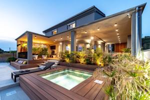 a house with a swimming pool on a deck at Rab Rental Villa in Rab +29 photos