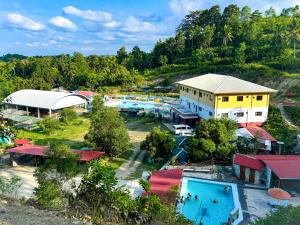 an aerial view of a resort with a pool at Juanito's Resort in Tangalan