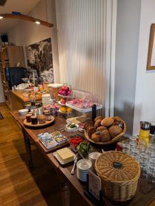 a table with food and bread on it at Ferienwohnung in Riol +9 photos