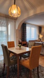 a dining room with a table and chairs at Bunkhouse & Apartments in Prishtinë