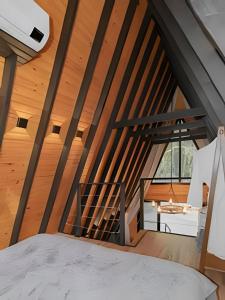Giường trong phòng chung tại Rosa Cabana dos Alpes
