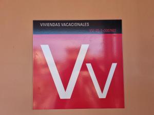a sign on a wall with the wordwx at Casa Azul in Lajares