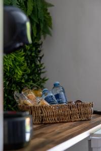 a basket of water bottles sitting on top of a counter at l'Everest Rooms in Marseille