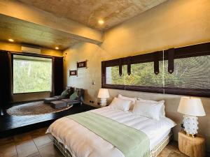 Postel nebo postele na pokoji v ubytování Zephyr Homestay