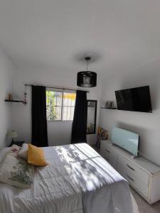 En eller flere senge i et værelse på Casa de playa en zona sur, cerca del mar