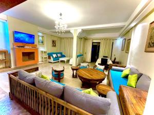 Χώρος καθιστικού στο Appartement le jardin avec piscine