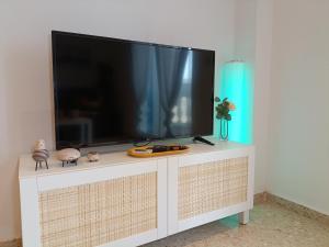 A television and/or entertainment centre at Seabreeze Lighthouse Apartment