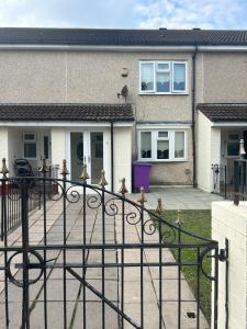 a wrought iron fence in front of a house at 2 bedroom house close to city centre with gated driveway in Liverpool