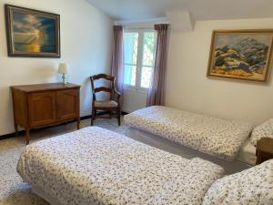 Posteľ alebo postele v izbe v ubytovaní Maison de maître Les toiles à Elise