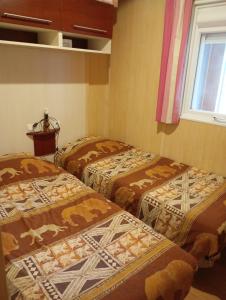 Ένα ή περισσότερα κρεβάτια σε δωμάτιο στο Chalet de vacances 5 couchages