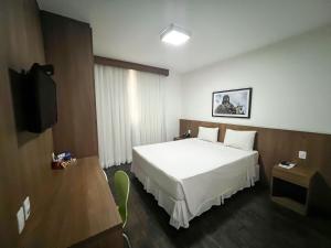Uma TV ou centro de entretenimento em Nobile Hotel Belo Horizonte