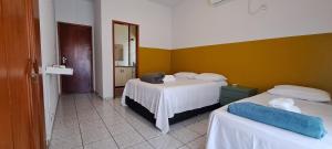 Ένα ή περισσότερα κρεβάτια σε δωμάτιο στο Casa Agradável no centro de Palmas TO +105 φωτογραφίες