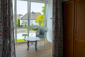 Ein Sitzbereich in der Unterkunft Hotel Klusenhof