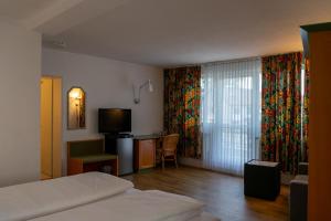 Ein Bett oder Betten in einem Zimmer der Unterkunft Hotel Klusenhof