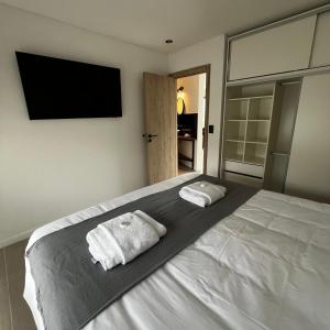 Una cama o camas en una habitación de Buenavista Chalten, Casa de Montaña