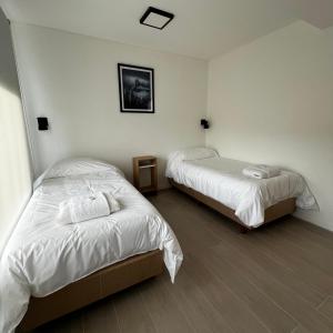 Una cama o camas en una habitación de Buenavista Chalten, Casa de Montaña